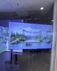 A scenic virtual landscape displayed across large screens